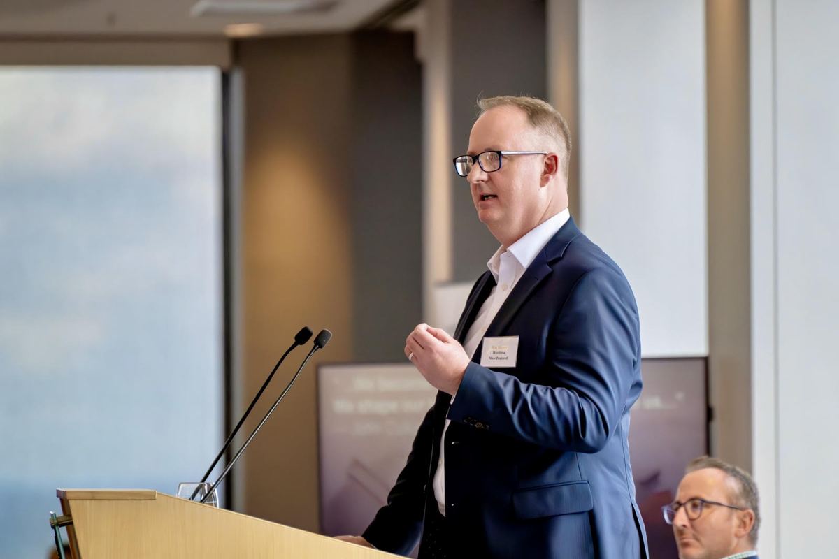 Rob Warner speaking at a lectern at a Victorian Department of Treasury and Finance session